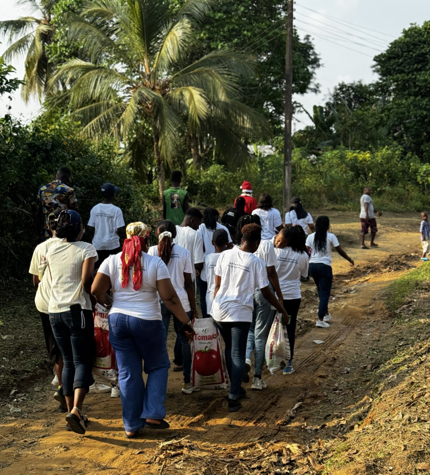 Group of volunteers in matching t-shirts working together on community outreach initiatives
