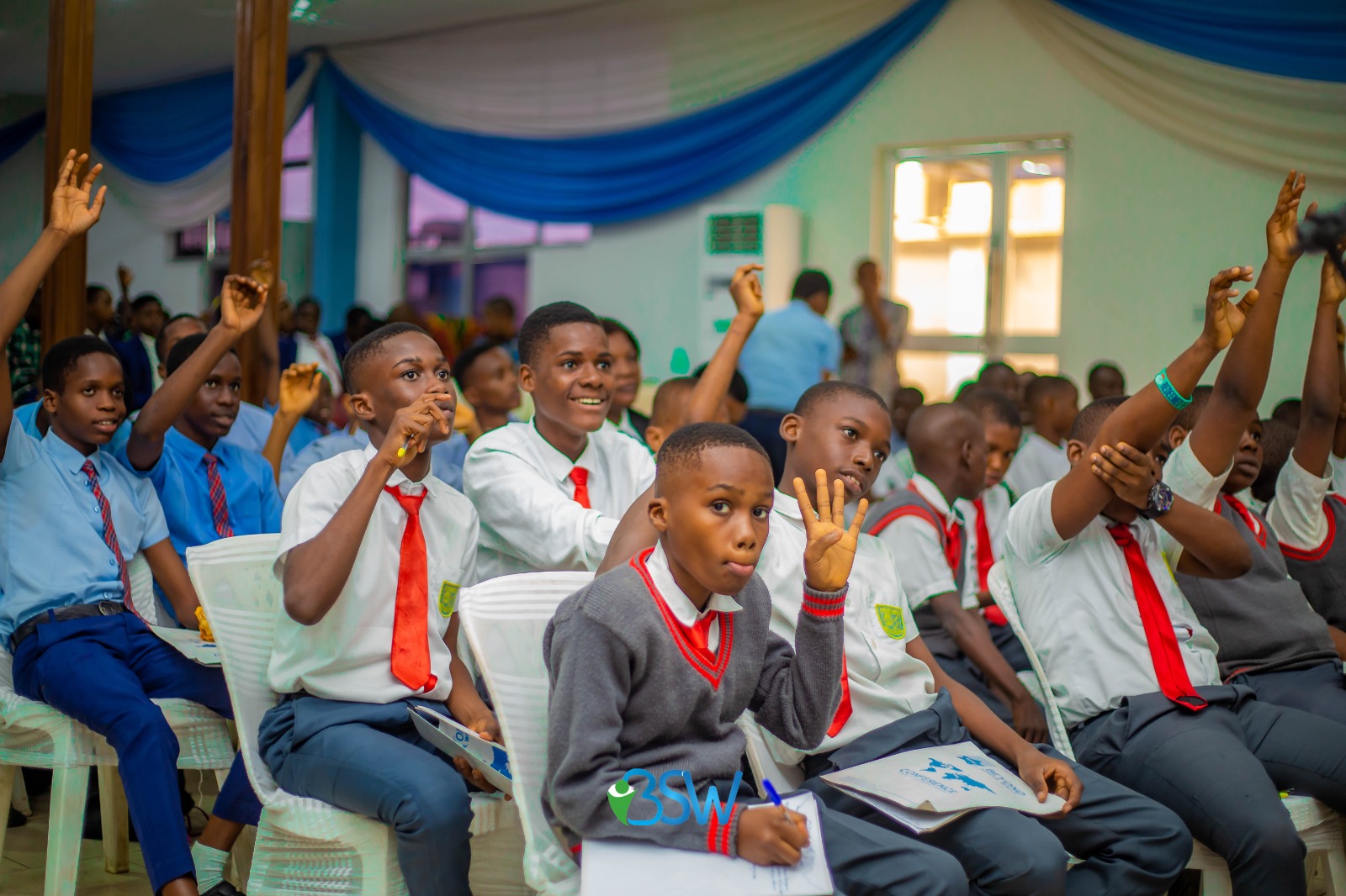 Young students in school uniforms engaged in learning, representing personal growth and values formation